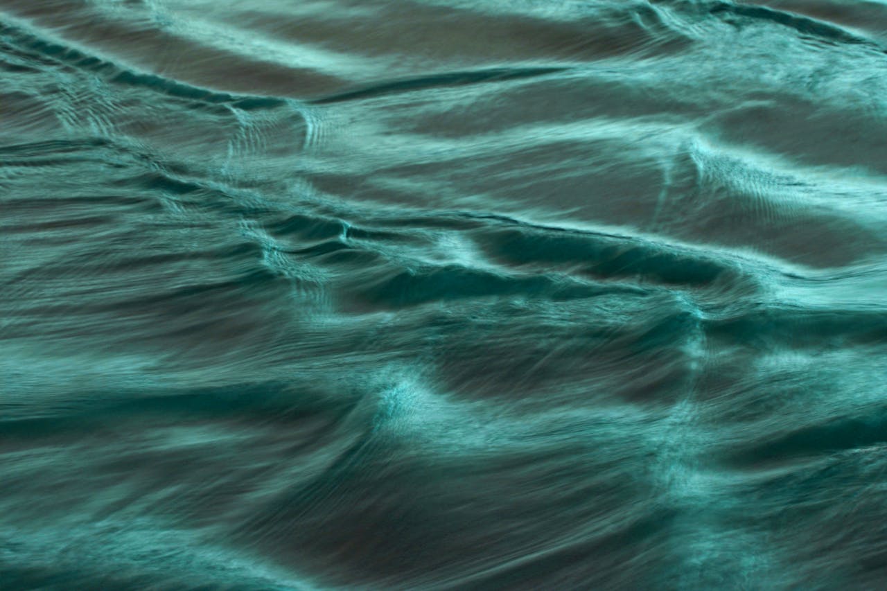 team-03 Calm ocean waves with a turquoise hue, captured in Guaratuba, Brazil. Perfect for relaxation themes.